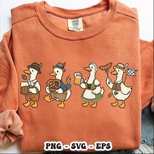 May include: An orange Comfort Colors sweatshirt featuring a cartoon design of four ducks dressed in traditional Bavarian attire. Each duck holds a beer stein, pretzel, sausage, or flag. The bottom of the shirt has the text "PNG - SVG - EPS".