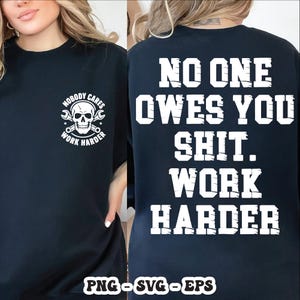 May include: Black t-shirt with white text and graphics. The front features a skull graphic with the words "NOBODY CARES WORK HARDER". The back of the shirt displays "NO ONE OWES YOU SHIT. WORK HARDER".