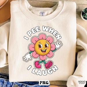 以下が含まれることがあります： 「I PEE WHEN I LAUGH」の文字が入ったクリーム色のスウェットシャツ。 黄色の中心、ピンクの花びら、白い手袋と靴を持つ漫画の花がスウェットシャツの中央にあります。
