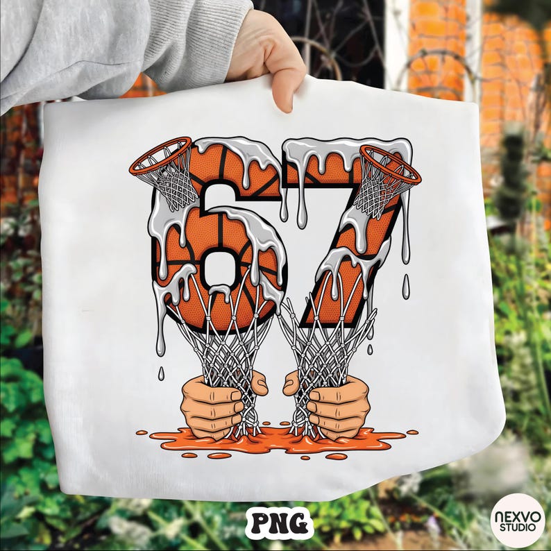 May include: White tote bag featuring the number "67" in an orange basketball design with a dripping effect. The design includes basketball nets and hands holding the nets. The bottom of the design has a puddle effect. The bottom of the bag has the text "PNG".
