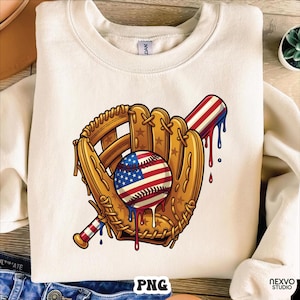 May include: Cream-coloured sweatshirt featuring a baseball glove, baseball, and bat with a patriotic design. The baseball has the American flag on it, and the design has red, white, and blue dripping accents. The word "PNG" is at the bottom.