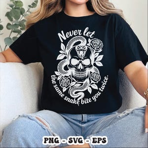 May include: Black t-shirt featuring a white skull with a snake coiled around it, surrounded by roses. The text "Never let the same snake bite you twice" is printed in white. The bottom of the shirt displays "PNG - SVG - EPS".
