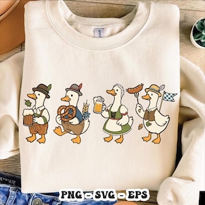 May include: Cream-colored sweatshirt featuring a cartoon illustration of four ducks dressed in traditional Bavarian attire. Each duck is holding items like beer, pretzels, and sausages, with the text "PNG SVG EPS" at the bottom.