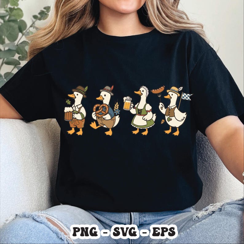 May include: Black t-shirt featuring a cartoon illustration of four ducks dressed in traditional Bavarian attire. The ducks are holding beer steins, pretzels, and a sausage. The shirt has the text "PNG - SVG - EPS" at the bottom.
