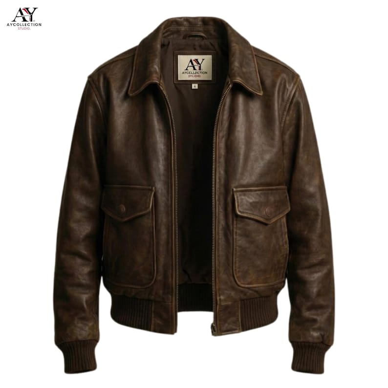 May include: A brown leather jacket with a classic bomber style. The jacket features a collared neckline, two front pockets, and ribbed cuffs and hem. The jacket has a distressed look and a zipper closure.