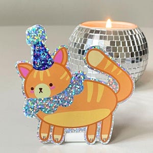 Lindo adhesivo holográfico brillante de gato payaso naranja