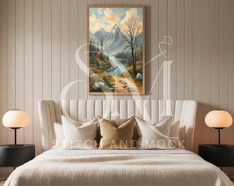 May include: A white upholstered bed with a high headboard and a beige duvet. The bed is decorated with two white pillows and a brown pillow. A framed painting of a mountain landscape hangs above the headboard. Two black bedside tables with round lamps are on either side of the bed.