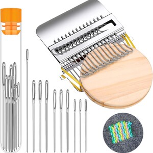 May include: A collection of sewing tools, including needles, a needle threader, and a wooden circular weaving loom. The needles are silver and come in various sizes. The loom has a metal frame and a wooden base. A small embroidery sample is also included.
