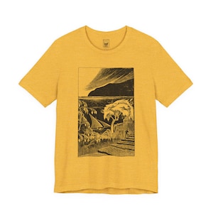 May include: Mustard yellow t-shirt with a black and white coastal illustration. The artwork shows a sailboat, trees, and a person ascending stairs. The shirt has a crew neck and short sleeves.