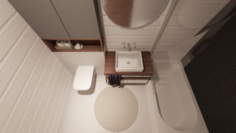 Puede incluir: Interior de ba&ntilde;o moderno con inodoro, lavabo y ba&ntilde;era blancos. El lavabo est&aacute; sobre un mueble de madera con un grifo cromado. Una alfombra redonda beige est&aacute; en el suelo. Un armario gris y un espejo est&aacute;n montados en la pared.