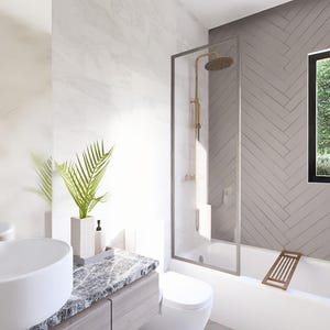May include: Modern bathroom interior with a white oval sink, marble countertop, and a glass shower enclosure. The room features a bathtub, a window with a view of greenery, and a gray herringbone tile wall. A decorative plant adds a touch of nature.