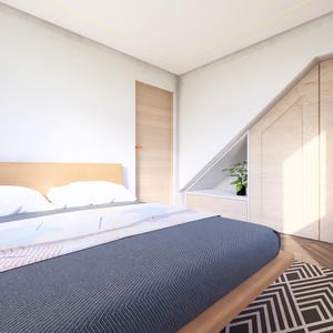 May include: A bedroom with a wooden bed frame, white pillows, and a blue comforter. A patterned rug sits on the floor. The room has a wooden door and built-in closet with a small plant. The walls are white.