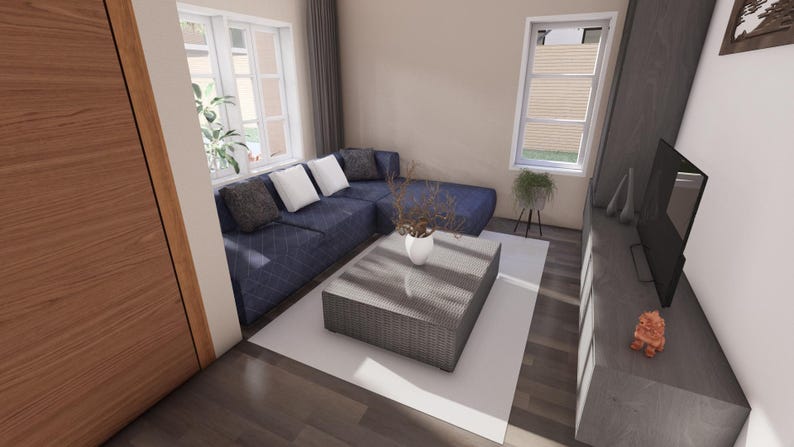 Peut inclure: Un salon moderne avec un canap&eacute; d'angle bleu, une table basse grise tress&eacute;e et un tapis blanc. La pi&egrave;ce dispose de grandes fen&ecirc;tres, d'une t&eacute;l&eacute;vision et de plantes d&eacute;coratives. Les murs sont peints dans des couleurs neutres, cr&eacute;ant une atmosph&egrave;re lumineuse et a&eacute;r&eacute;e.