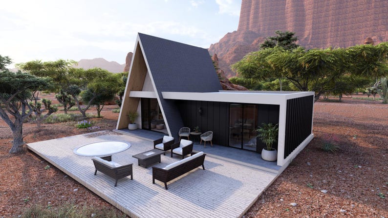K&ouml;nnte beinhalten: A-Frame-H&uuml;tte mit dunkelgrauem Dach und schwarzen Au&szlig;enw&auml;nden. Die H&uuml;tte hat gro&szlig;e Fenster und eine Holzterrasse mit Gartenm&ouml;beln, darunter ein Sofa, St&uuml;hle und ein Couchtisch. Ein Whirlpool befindet sich ebenfalls auf dem Deck.