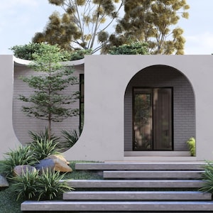 May include: Architectural rendering of a modern, minimalist house with a light-colored exterior. The design features a curved archway, large windows, and a series of steps leading to the entrance. Landscaping includes greenery and large rocks.