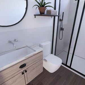 May include: A modern bathroom with a white toilet, a wooden vanity with a white sink, and a black-framed shower. A round black mirror hangs above the vanity. A small potted plant sits on the vanity and on a shelf above the toilet.
