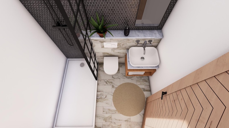 Puede incluir: Vista superior de un ba&ntilde;o moderno con ducha, inodoro y lavabo. La ducha tiene un marco de metal negro y un techo de baldosas gris oscuro. Una peque&ntilde;a planta se encuentra en un estante de m&aacute;rmol sobre el lavabo. Una alfombra redonda beige est&aacute; en el suelo.