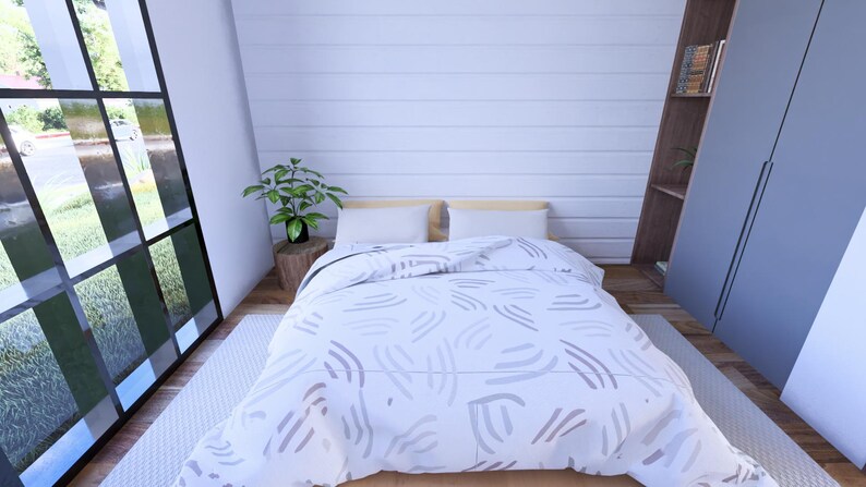 Puede incluir: Un dormitorio con una cama cubierta con un edred&oacute;n blanco con un patr&oacute;n abstracto gris. La habitaci&oacute;n tiene una ventana grande, una peque&ntilde;a planta en una mesa de madera y un armario gris. Las paredes son blancas.