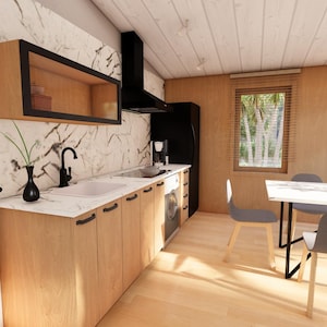 May include: Interior view of a contemporary kitchen featuring light wood cabinets, a white countertop, and a black extractor fan. A black vase and tap are visible. A dining area with a white table and grey chairs is in the background.