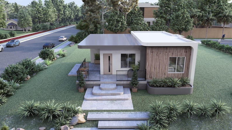 May include: An aerial view of a modern, single-story house with a flat roof and a minimalist design. The house features a combination of white, gray, and wood paneling, with a small porch and a well-manicured lawn. Cars are visible on the street.