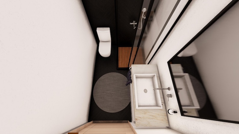 May include: An overhead view of a modern bathroom with a white toilet, a rectangular sink, and a large mirror. The floor has a dark gray circular rug and a wooden shower bench. The walls are white and black.