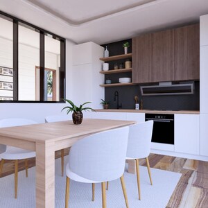 Puede incluir: Una moderna cocina y comedor con gabinetes de madera clara, paredes blancas y una mesa de comedor de madera clara con cuatro sillas blancas. Una peque&ntilde;a planta est&aacute; sobre la mesa. La cocina cuenta con un horno negro y una campana extractora.