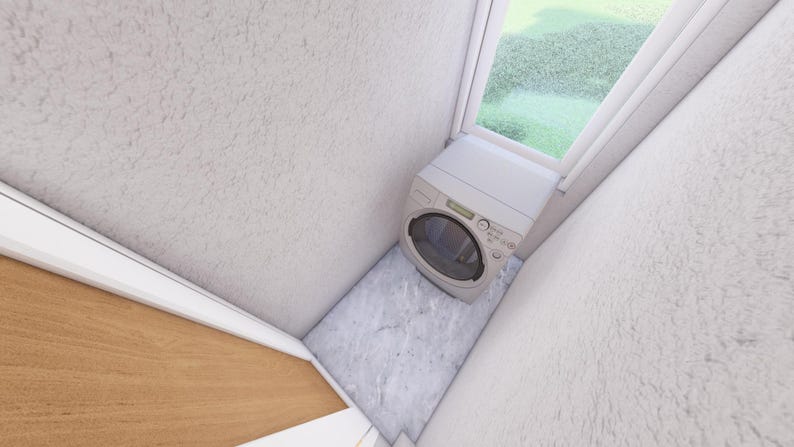 May include: A small, white washing machine is positioned in a corner near a window. The walls are textured and painted white. The floor is a light gray color. The window looks out onto a green, grassy area.