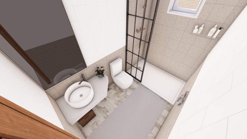 Peut inclure: Vue a&eacute;rienne d'une salle de bain moderne. Comprend un lavabo ovale blanc, des toilettes, une douche avec un cadre en grille noir et un tapis gris clair. Les murs sont carrel&eacute;s dans une couleur neutre, et une petite plante ajoute une touche de vert.