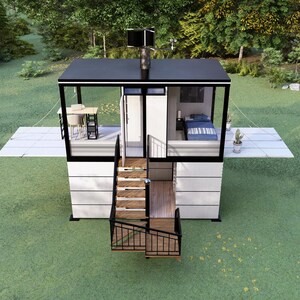 Op de afbeelding: Een modern, twee verdiepingen tellend tiny house met een zwart dak en witte gevelbekleding, gelegen op een grasveld. Het huis heeft een klein terras, trappen en grote ramen. Het interieur omvat een slaapkamer en een kleine kantoorruimte.