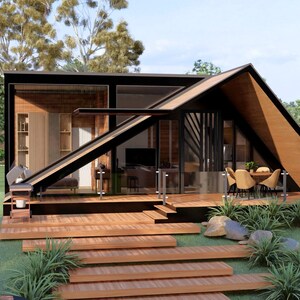 May include: A modern, architectural rendering of a small house with a unique A-frame roof design. The house features a wooden deck, glass walls, and a minimalist interior. Landscaping includes grass, plants, and stone accents.