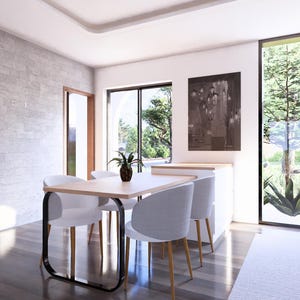 May include: A dining room with a light wood table and four white chairs. A large window offers a view of a tree and greenery. The room has a wooden door and a gray stone wall.