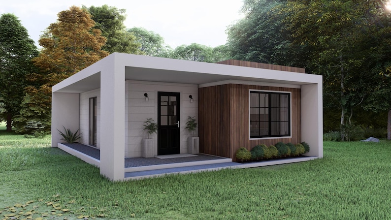 May include: A modern, minimalist home with a flat roof and a white exterior. The front door is black, and there are small potted plants on either side. The house has a wooden accent wall and a large window with black frames. The home is surrounded by green grass and trees.