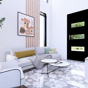 May include: A contemporary living room featuring a white sofa, armchair, and walls. A black door with rectangular windows and abstract art. Two round coffee tables and a large TV are also present, creating a stylish interior.