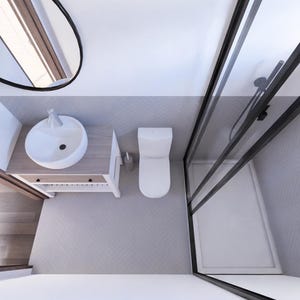 K&ouml;nnte beinhalten: Draufsicht auf ein modernes Badezimmer mit wei&szlig;em Waschbecken, Toilette und Dusche. Die Dusche hat einen schwarzen Rahmen und eine Glast&uuml;r. Der Boden ist hellgrau mit Fischgr&auml;tmuster. Ein runder Spiegel h&auml;ngt an der Wand.