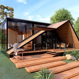 May include: Modern, geometric house with a wooden deck and walkway. The house features large glass windows, a sloped roof, and a built-in grill. Landscaping includes grass, rocks, and plants, with a blue sky in the background.