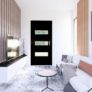 May include: A modern living room with a white sofa, a black door with glass panels, and a large framed black and white photograph. The room features a wooden accent wall and a low coffee table.