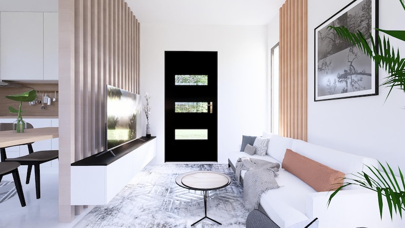 May include: A modern living room with a white sofa, a black door with glass panels, and a large framed black and white photograph. The room features a wooden accent wall and a low coffee table.