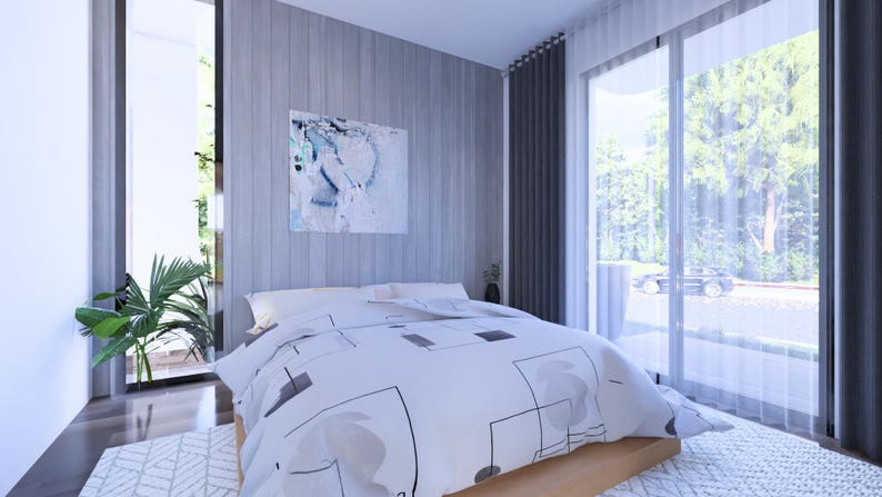 May include: A modern bedroom with a large bed covered in a white duvet with a geometric pattern. The room features large windows with sheer curtains, a piece of abstract art, and a green plant. The walls are a light gray color.