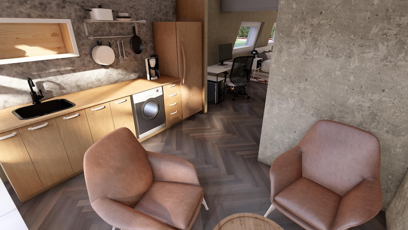 May include: Interior shot of a modern kitchen and living space. The kitchen features wooden cabinets, a black sink, and a washing machine. Two pink armchairs face each other in the living area. The floor has a herringbone pattern.