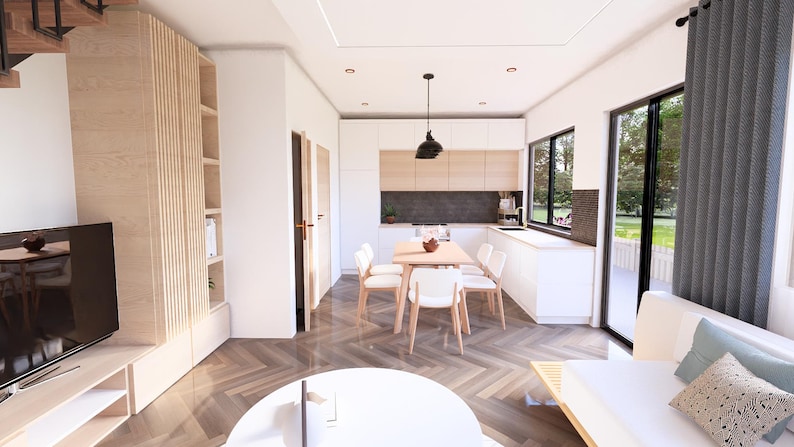 May include: Interior view of a modern living space with a kitchen and dining area. The room features white walls, wooden floors, and a combination of white and light wood furniture. A dining table with four chairs is set up near the kitchen.