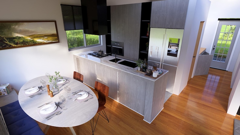May include: Interior view of a contemporary kitchen and dining space. The kitchen has light wood cabinets, a stainless steel fridge, and a black extractor fan. A round dining table is set with plates and cutlery. The flooring is hardwood.