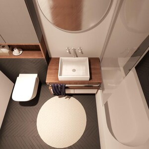 Peut inclure: Vue a&eacute;rienne d'une salle de bain moderne avec toilettes, lavabo et baignoire blancs. Le lavabo est pos&eacute; sur un meuble en bois. Un tapis rond cr&egrave;me est pos&eacute; sur le sol sombre &agrave; chevrons. Une &eacute;tag&egrave;re en bois contient des articles de toilette.