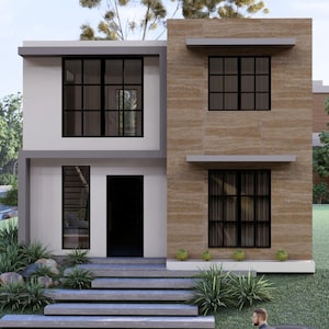 Puede incluir: Una casa moderna de dos pisos con un exterior blanco y beige. La casa presenta grandes ventanas con marcos negros, una puerta principal oscura y un peque&ntilde;o jard&iacute;n delantero con paisajismo. Una carretera y &aacute;rboles son visibles en el fondo.