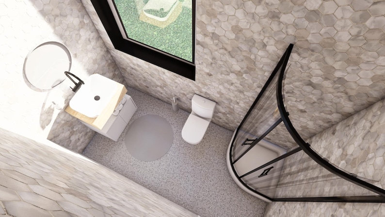 May include: An overhead view of a modern bathroom with a white toilet, sink, and shower. The walls and floor are covered in a light gray hexagonal tile. A round mirror and a window are also visible.