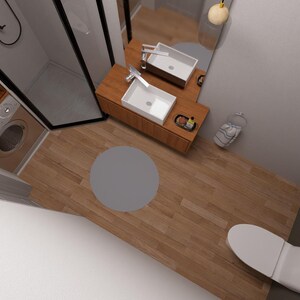 May include: An overhead view of a modern bathroom with a wooden floor. The room features a white toilet, a sink with a wooden vanity, a shower, and a washing machine. A gray circular rug is on the floor.