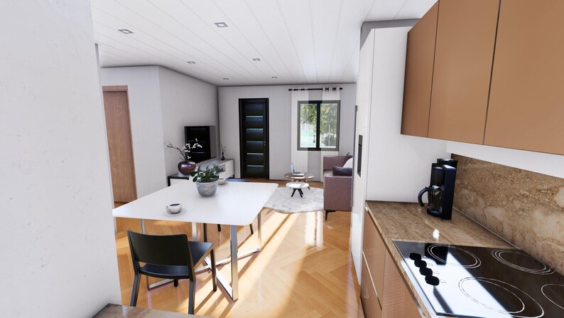 Puede incluir: Vista interior de un espacio habitable moderno con cocina y comedor. La cocina cuenta con armarios marrones, una placa de cocina y una cafetera. El comedor tiene una mesa blanca y una silla negra. El sal&oacute;n incluye un sof&aacute; y una ventana.