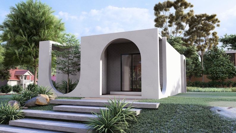 May include: Architectural rendering of a modern, minimalist building with a white facade and arched openings. The building has a flat roof and large glass doors. Landscaping includes green grass, shrubs, and trees. A set of concrete steps leads to the entrance.