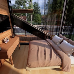 May include: A modern bedroom with a large window overlooking a green landscape. The room features a bed with a brown comforter and white pillows, a wooden dresser, and a mounted television. The walls are paneled with light-colored wood.