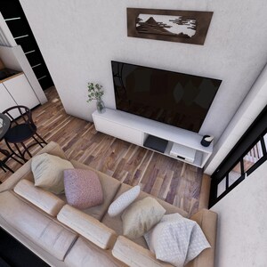 May include: An overhead view of a modern living space with a beige sofa, a black TV, and a white entertainment unit. A round glass table with black chairs is in the kitchen area. The room has hardwood floors and a decorative wall art.