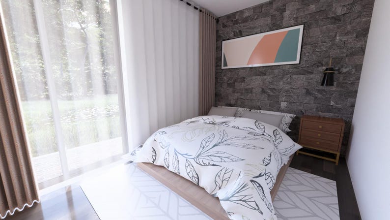 May include: A modern bedroom with a bed covered in a white and gray leaf-patterned comforter. The room features a gray stone accent wall, a wooden nightstand, and a large window with sheer curtains. An abstract artwork hangs above the bed.
